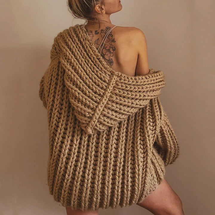 Woman wearing beige CozyNest sleeveless knit vest for women with her back turned